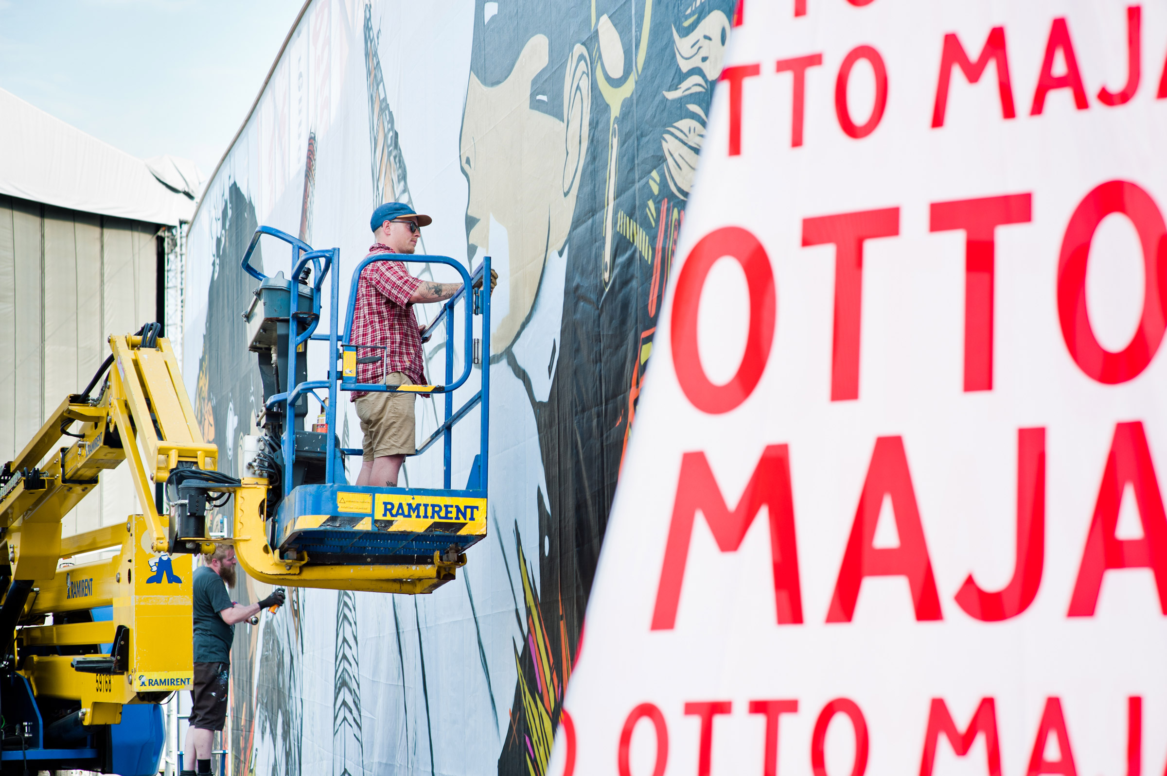 Otto Maja painting his art piece at Flow Festival 2013