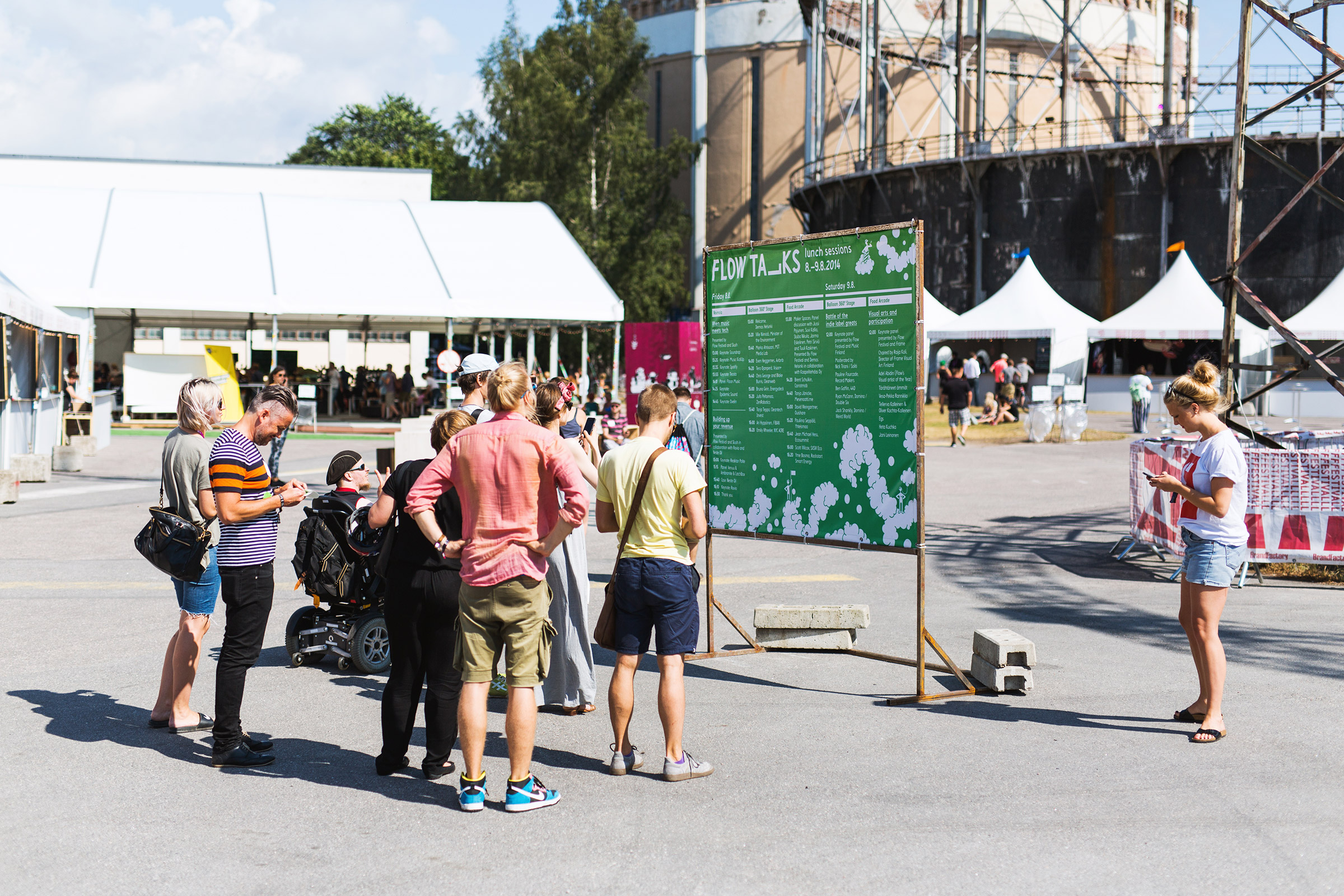 People looking at Flow Talks sign at Flow Festival 2014